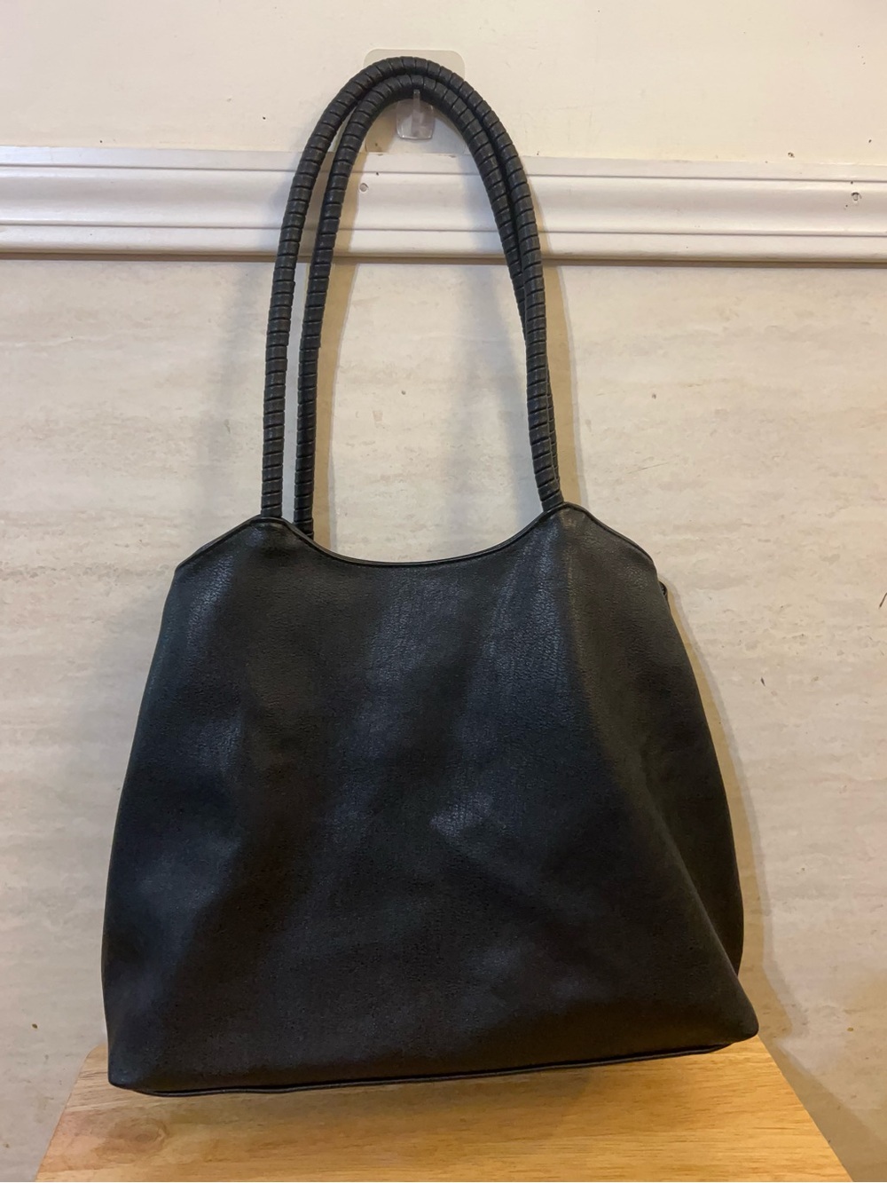 Antik Kraft black faux vegan leather shoulder bag, distinct double coiled handle